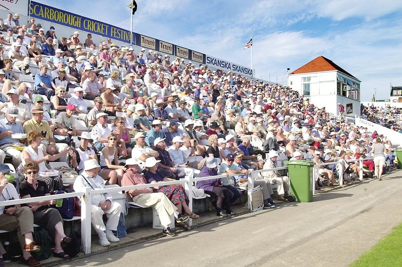 The fans bask in the sun during a Scarborough Cricket Festival match