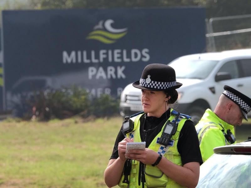 An officer taking details.
