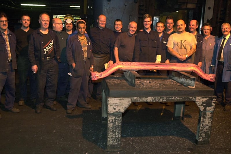 Decades of industry was set to end at Kirkstall Forge. Pictured are workers with the  last stamped axel in October 2002 ahead of the site closure at Christmas.