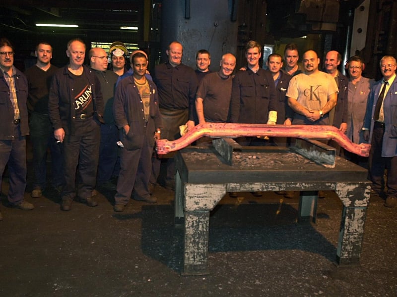 Decades of industry was set to end at Kirkstall Forge. Pictured are workers with the  last stamped axel in October 2002 ahead of the site closure at Christmas.