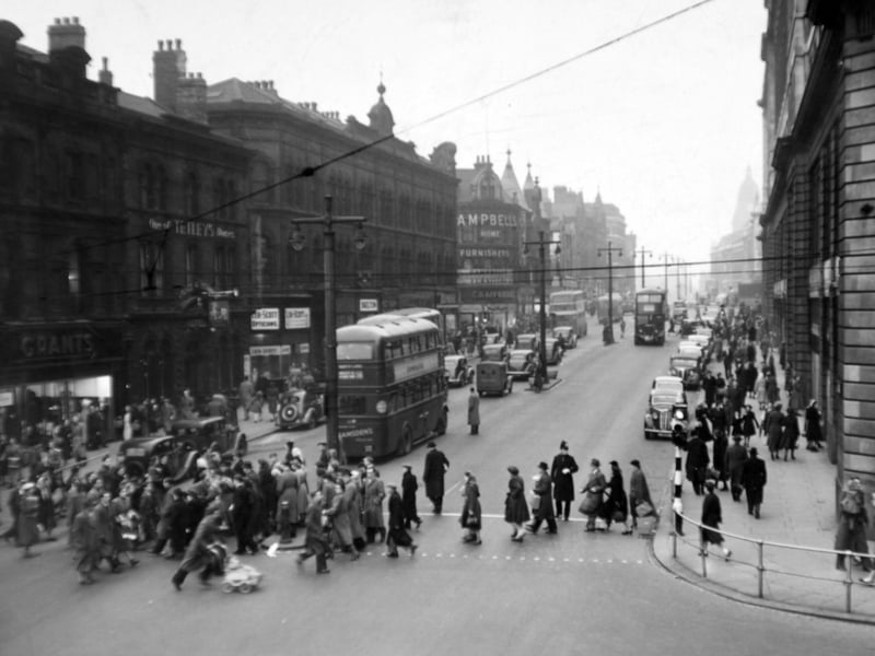 Saturday afternoon shoppers on The Headrow in December 1951.