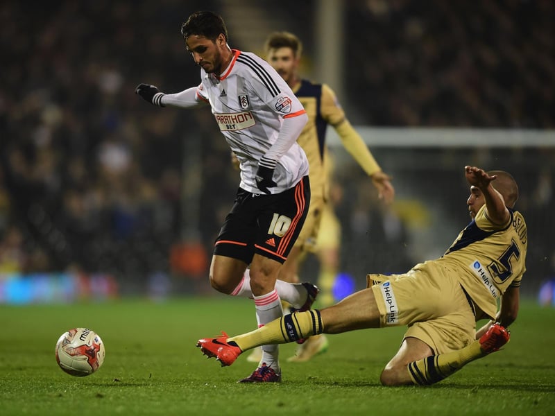 Giuseppe Bellusci tackles Fulham's Bryan Ruiz.