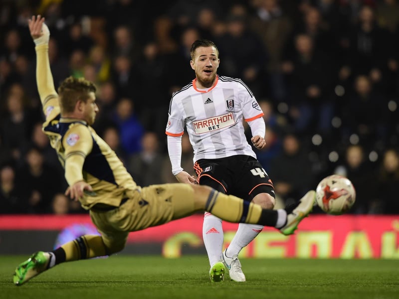 Fulham's Ross McCormack shoots past Gaetano Berardi.