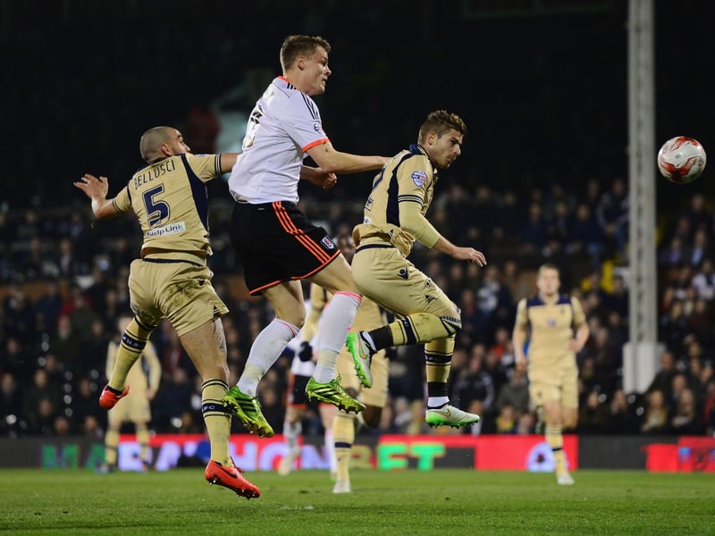 Fulham's Matt Smith out-jumps Giuseppe Bellusci (left) and Gaetano Berardi.