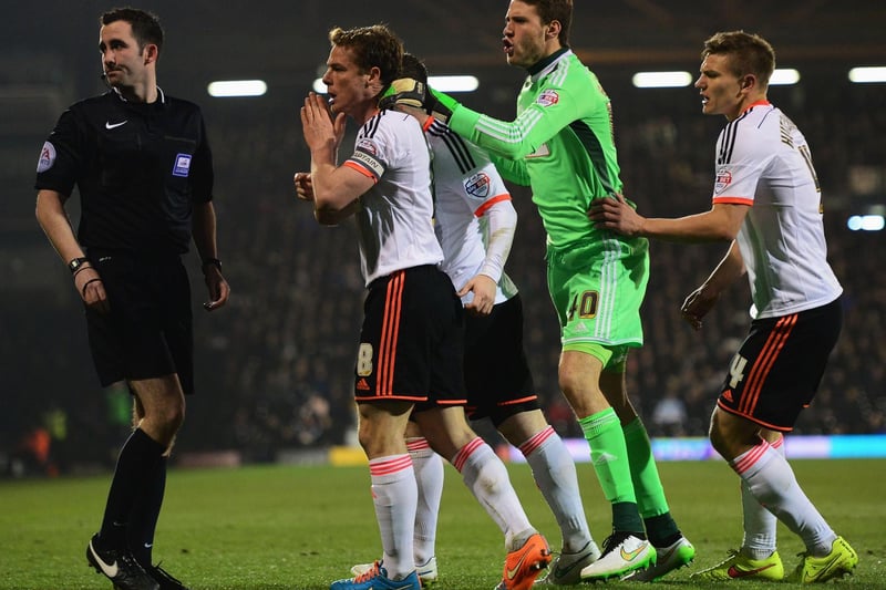 Fulham's Scott Parker leads the protests to referee Chris Kavanagh after Kostas Stafylidis (not pictured) was sent off.