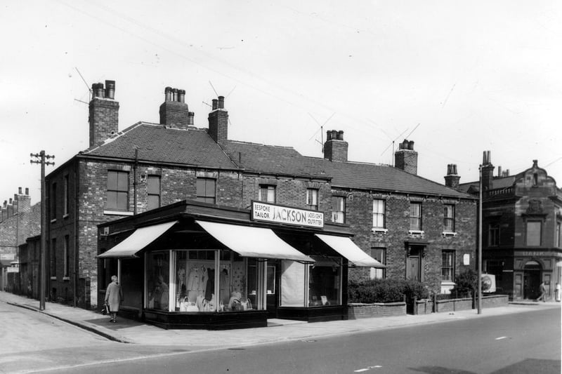 Looking across Dewsbury Road in May 1964 to private housing and shop property. A woman is walking up Bewerley Street on the left.