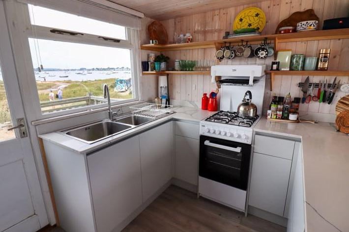 Marketed by Denisons Estate Agents, the hut comes with solar panels for electricity and bottled gas for cooking and costs more than two times the price of an average house in England.