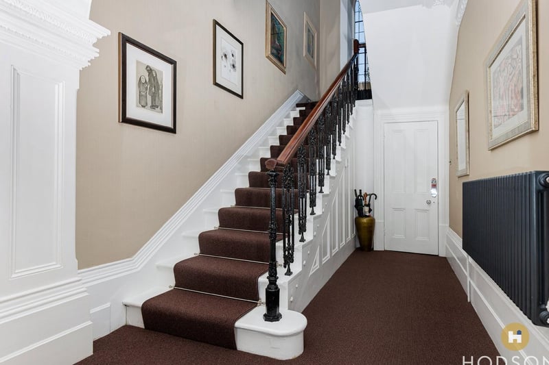 The feature staircase leading up from the entrance hallway.