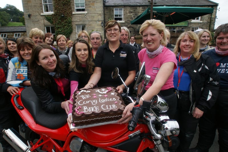 Postgate bikers group celebrates with cake at the Postgate Inn, Egton.