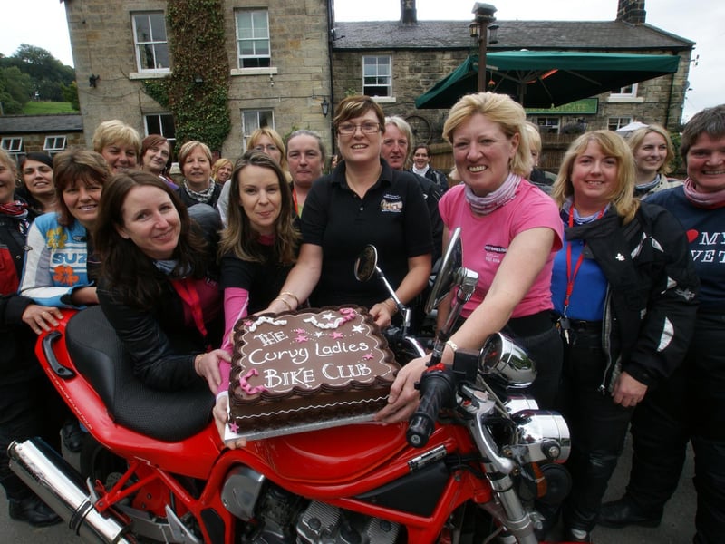 Postgate bikers group celebrates with cake at the Postgate Inn, Egton.