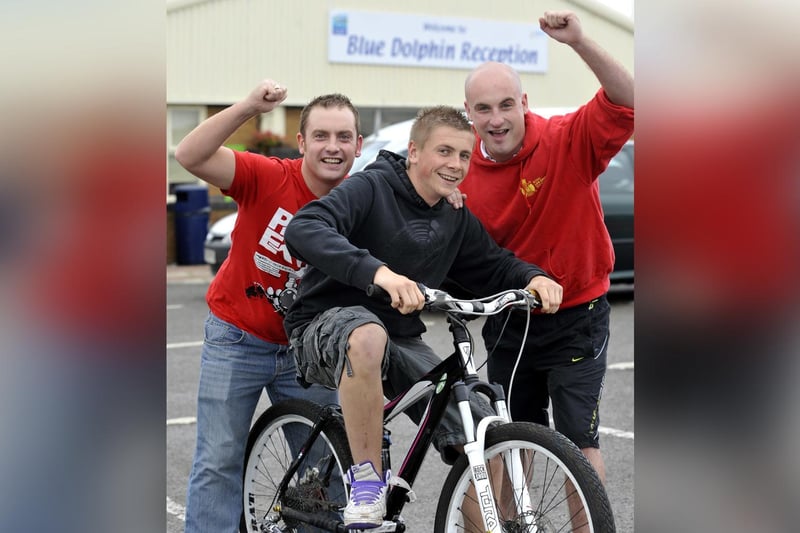 Brothers Mark and Craig Utley, with Jamie Sillett, centre, raise money for Age Concern.
