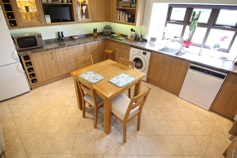 A bright and roomy kitchen with fitted units.