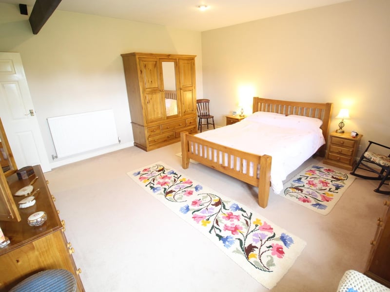 One of the spacious double bedrooms within the property.