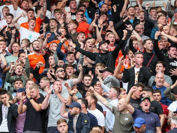 Blackpool fans celebrate their side's first away win of the season