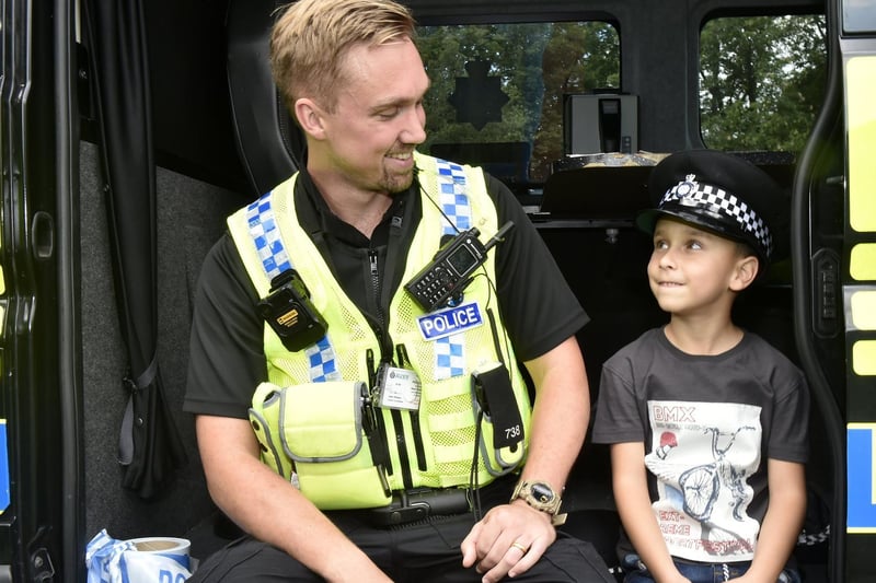 Amir Aboug Hamgid, six, of Beeston, chats to PC Adams from Elland Road police station.