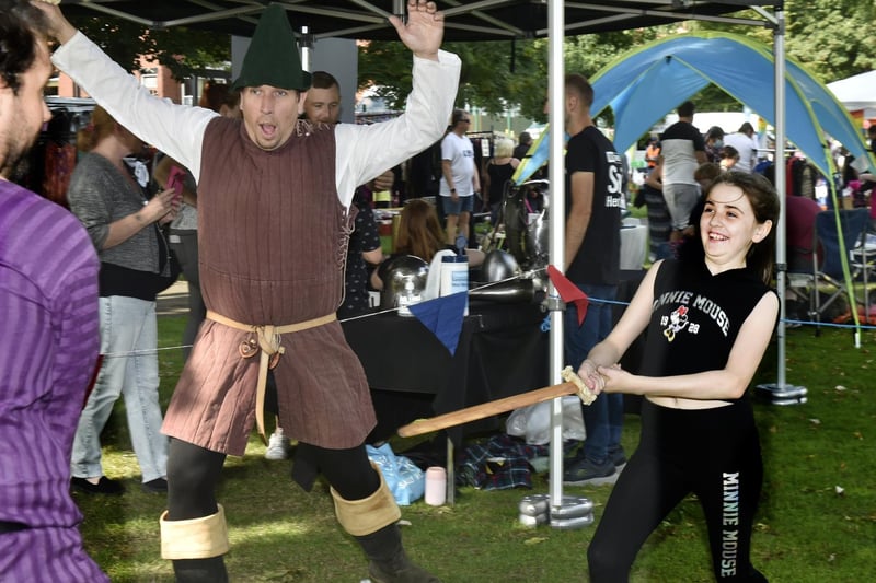 Savannah Sellers, 11, of Beeston, helps out with sword fighting on the Royal Armouries stand