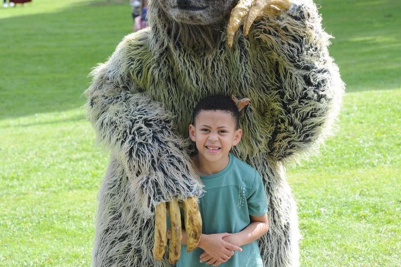Jace Varley, seven, of Beeston, meets a giant sloth from Giddy Kipper Arts, Todmorden.