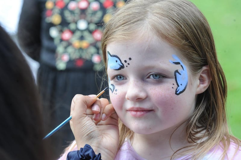 Tegan Marshall, nine, of Beeston, sits for face painting.