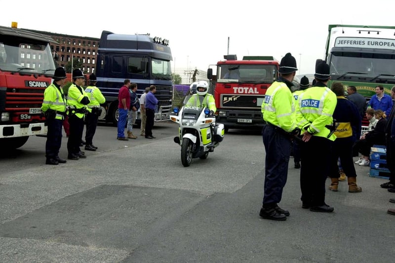 Police and pickets at the Total Fina Elf depot in Hunslet. An empty tanker arrives at the depot by police escort.