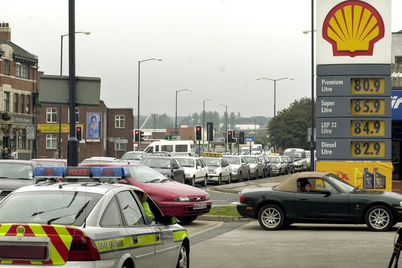 Police keep an eye on motorists at a Shell Station on Regent Street.