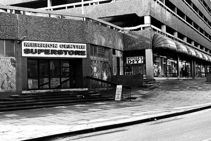 Merroin Centre from Merrion Way in February 1985. On the left is the Merrion Centre Superstore, an indoor retail market. To the right of this is Neville's D-I-Y.