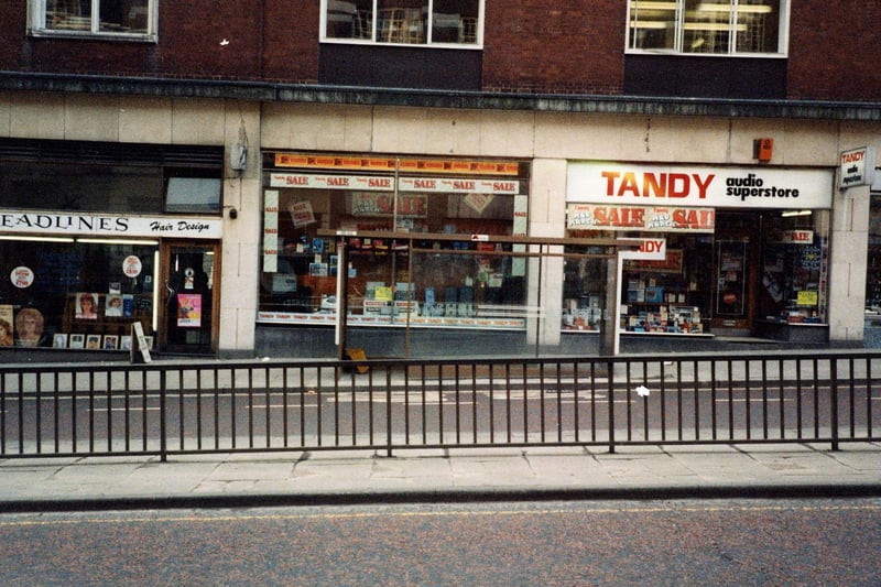 Shops on Eastgate in March 1984. Pictured, from left, is Headlines Hair Design, Tandys Hi-Fi and audio superstore, and just visible on the right, Peter Maturi Cutlery specialists.