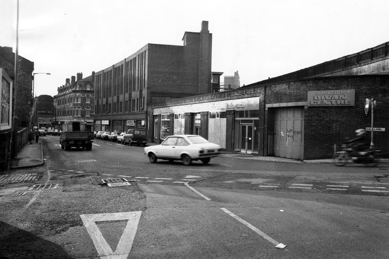 Call Lane seen from the junction with The Calls in November 1980. On the right is formerly Hadleigh of Leeds, upholstery and bedding. Next to this is Mottek International; and further along is the junction with Briggate, then the Golden Lion pub. In the distance on the left is the Queen's Hall.
