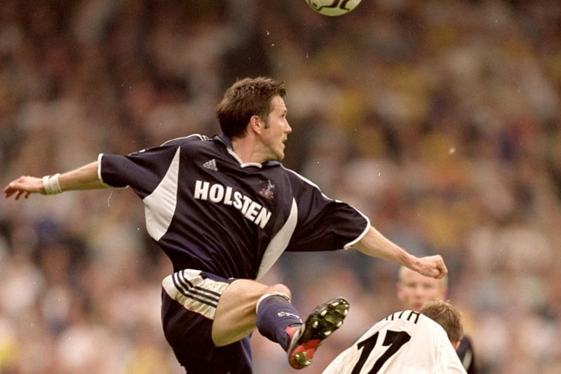 Tottenham Hotspur's Oyvind Leonhardsen outjumps Alan Smith.