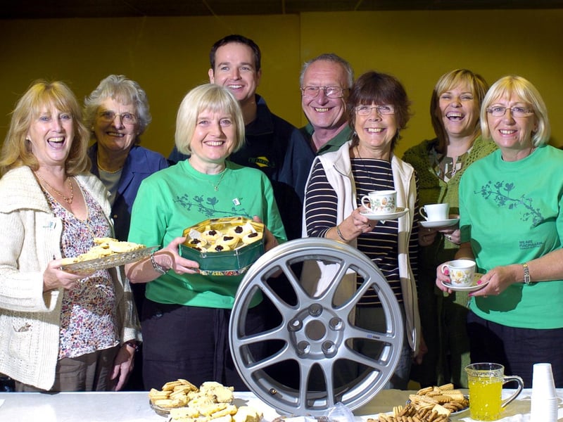 Staff at Castleton garage, Champions, host a Macmillan coffee morning.