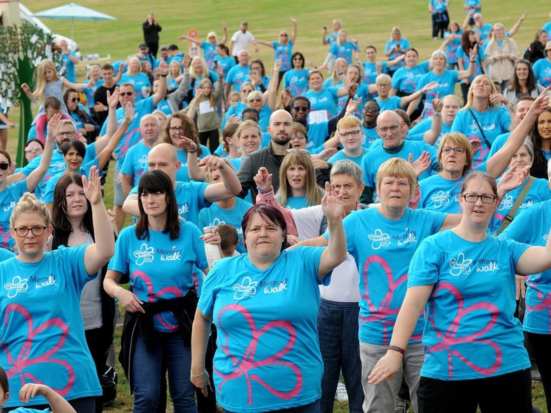 The walkers get warmed up ahead of the event