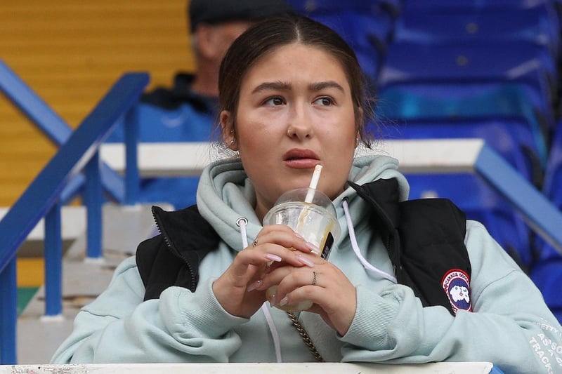 A PNE fan has a welcome drink on a warm day in Birmingham on Saturday