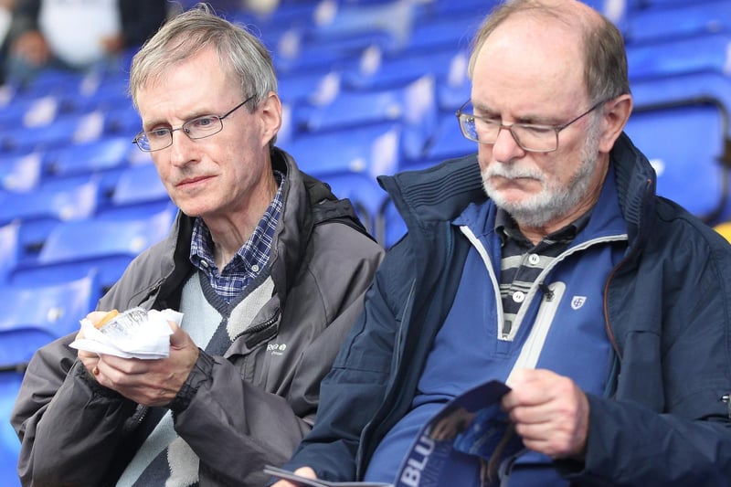A pre-match pie and a read of the programme for two PNE supporters