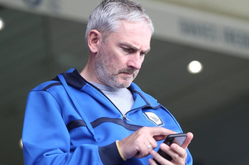 This Preston supporter checks out the latest news on his phone