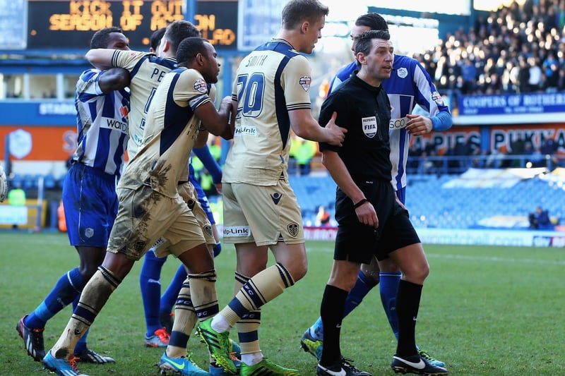 Matt Smith talks to referee Lee Probert after his challenge on Sheffield Wednesday's Reda Johnson during the Championship clash at Hillsborough in January 2014.