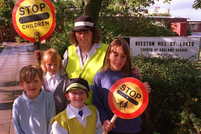 This is lollipop lady Mary Dean who was retiring after helping pupils at Beeston Hill St Luke's CofE School. She is pictured in August 1998 with, from left, Sam Hopkins, Emma Parkin, Jake Barns and Vicky Ouest.