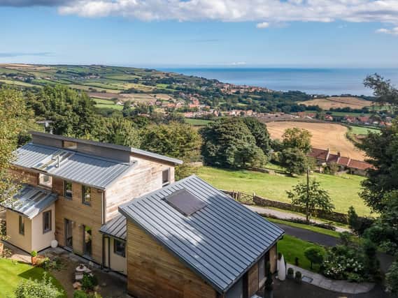 This 10-year old property has sweeping views of the coastline from its windows and gardens.