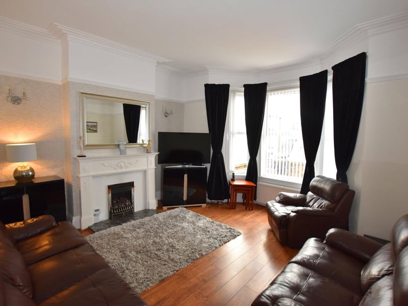 The comfortable lounge, with bay window and central fireplace.
