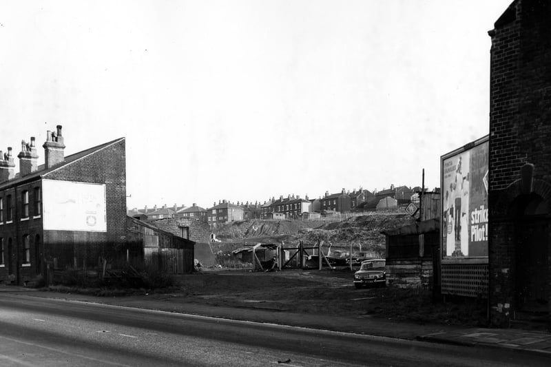 November 1967 and this photo is a view on Elland Road showing a fenced off area with parked cars and looking towards a refuse tip.
