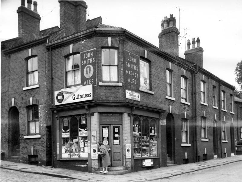 Malvern Road pictured at its junction with Algeria Street in July 1964. The corner shop has the name Thomas William Fletcher over the door and sells groceries, confectionery and is licensed to sell alcohol.
