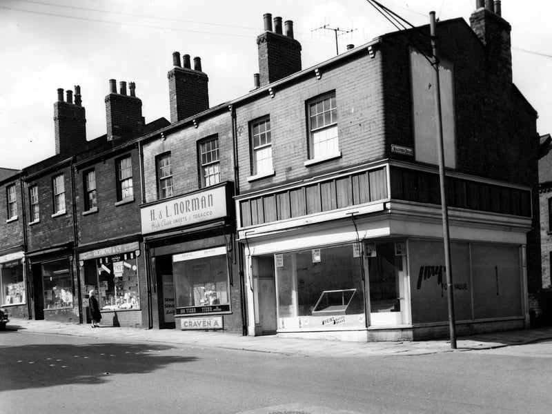 A parade of shops on Beeston Road in July 1964 taken opposite the junction with Malvern Road.