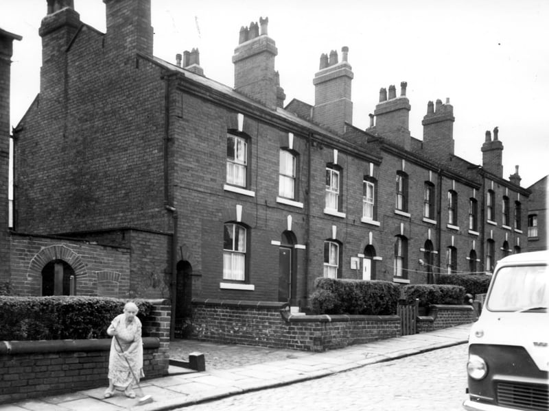 A view of back-to-back terraced houses constructed in red brick on Algeria Street in July 1964.