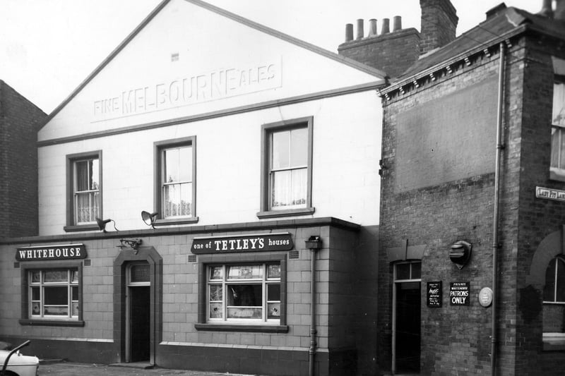 The Whitehouse, a Tetley public house, on Lady Pit Lane, junction with Folly Lane. It had previously belonged to the Melbourne Brewery. It is pictured in December 1965.