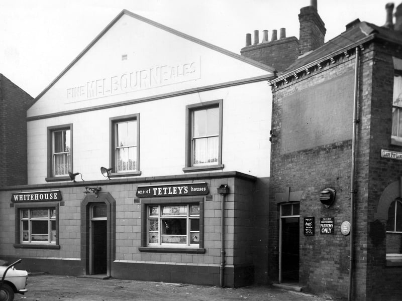 The Whitehouse, a Tetley public house, on Lady Pit Lane, junction with Folly Lane. It had previously belonged to the Melbourne Brewery. It is pictured in December 1965.