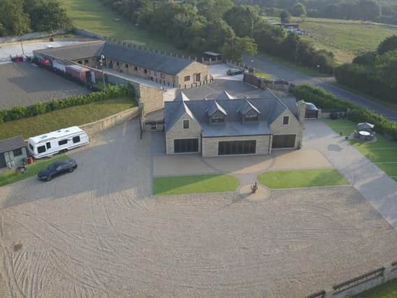 This five-bedroom equestrian property is on the market in New Farnley, with auction bids starting at 1.9million.