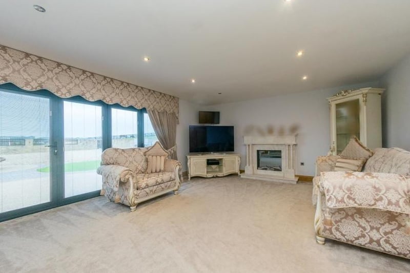 The living room is beautifully presented, with French windows opening to the rear of the property.