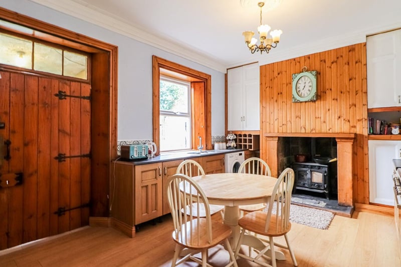 A large wooden door opens in to the spacious kitchen of the property.