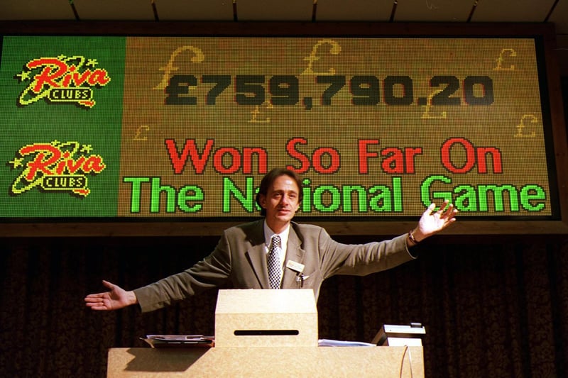 Alan Garban, deputy manager at the Riva Bingo Club in Wakefield, displays the amount won so far on The National Game in September 1999.