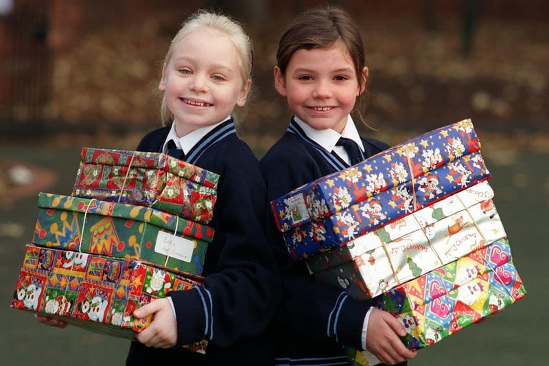 Wakefield Girls High School junior school pupils Antonia Wimbush (left) and Helen Walker with some of the parcels for the YP Shoebox Appeal in November 1999.