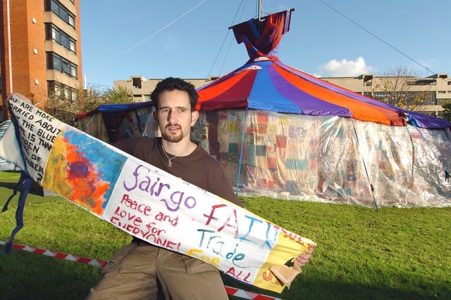 Ed Carlisle from Together For Peace in-front of the Big Dress, a colourful patchwork big-top tent developed by Speak, a campaigning and prayer network to promote awareness about sweatshop labour.