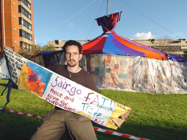 Ed Carlisle from Together For Peace in-front of the Big Dress, a colourful patchwork big-top tent developed by Speak, a campaigning and prayer network to promote awareness about sweatshop labour.